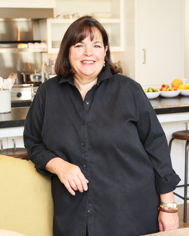 Ina Garten leaning against a counter in a large kitchen