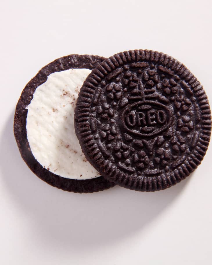 oreo cookie partly open on white background