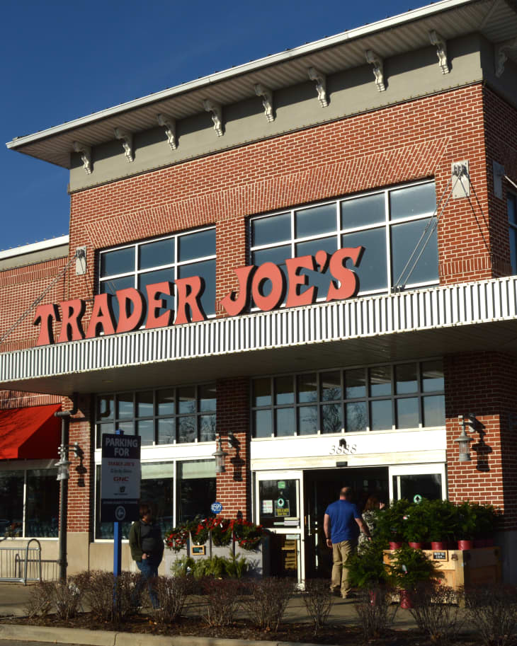 Trader Joe's exterior and sign. Trader Joe's is an American privately held chain of specialty grocery stores headquartered in Monrovia, CA.