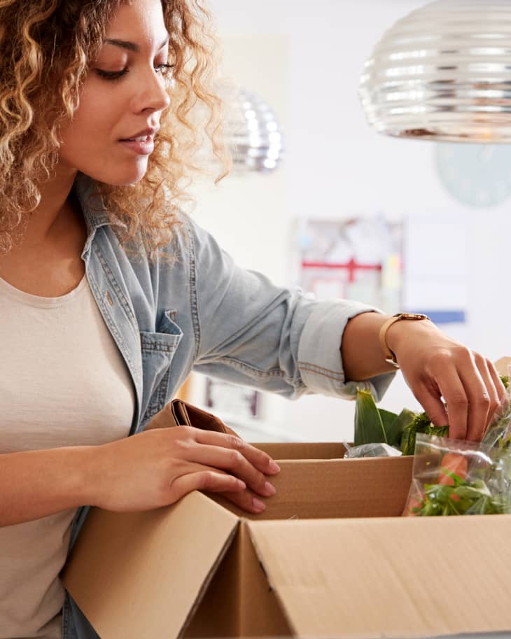Woman Unpacking Online Home Food grocery Delivery
