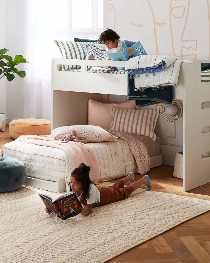 two kids reading in a low toddler bunk bed from crate &amp; kids