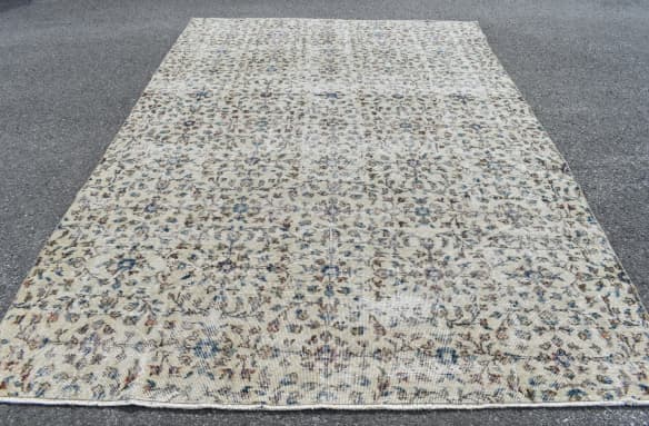 Vintage Etsy Rug in a light palette with tans and blue