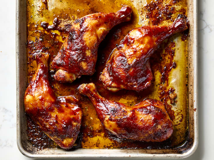 overhead shot of Millie Peartree's BBQ chicken legs on a sheet pan