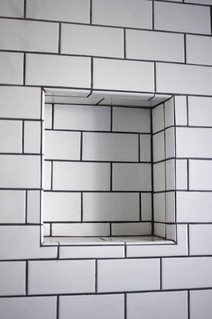 Shower shelves in outlet wall