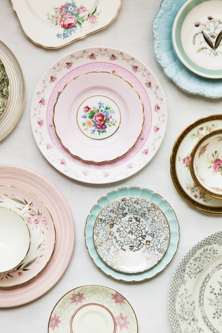 assorted china plates stacked together