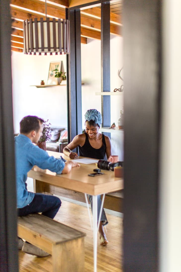 A couple sitting down at a table together