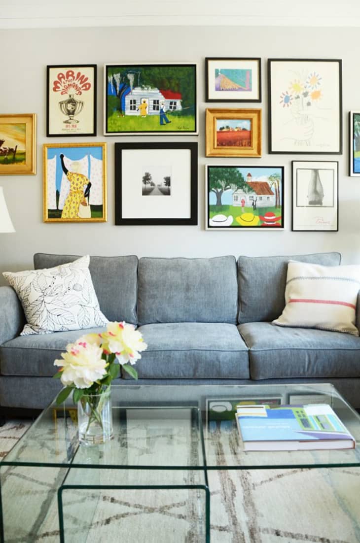 A home with a colorful gallery wall over the couch.