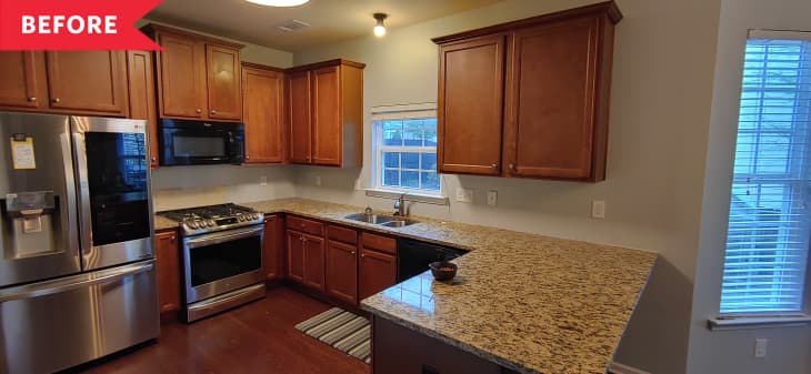 Before: Dated kitchen with dark wooden cabinets and floors and tan countertops