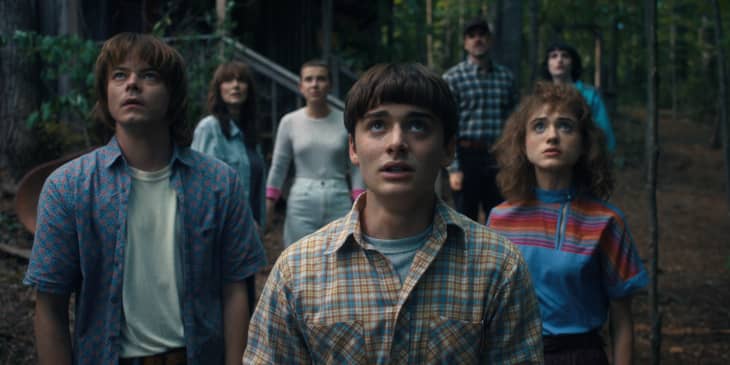 Charlie Heaton as Jonathan Byers, Winona Ryder as Joyce Byers, Millie Bobby Brown as Eleven, Noah Schnapp as Will Byers, David Harbour as Jim Hopper, Natalia Dyer as Nancy Wheeler, and Finn Wolfhard as Mike Wheeler in STRANGER THINGS.
