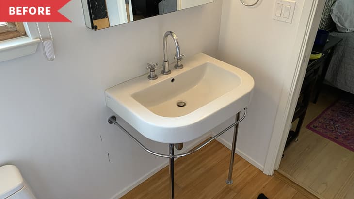 Before: Pedestal sink in bathroom