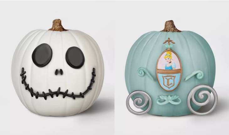 White pumpkin with Jack Skellington face and blue pumpkin styled as Cinderella's carriage.