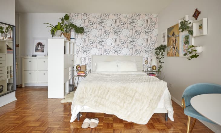 a cube shelving system creates the illusion of a separate sleeping space