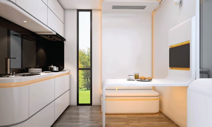 Interior of kitchen with lots of curved lines in tiny home