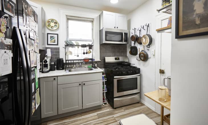 White small kitchen with lots of hanging storage