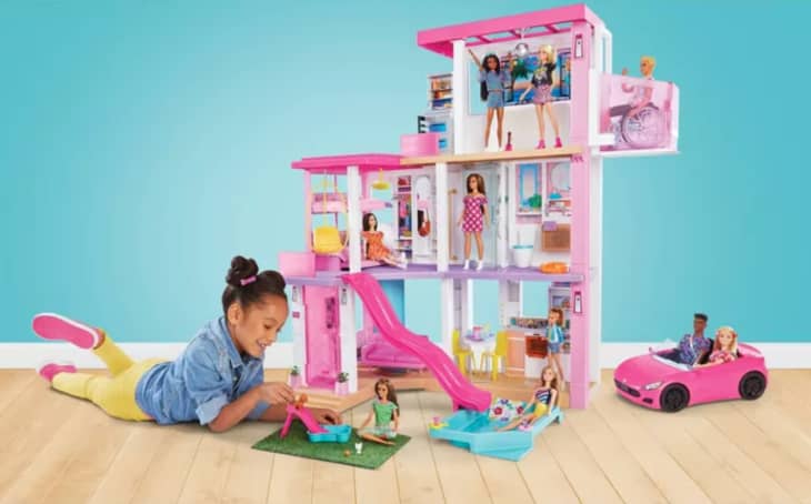 Girl playing with Barbies