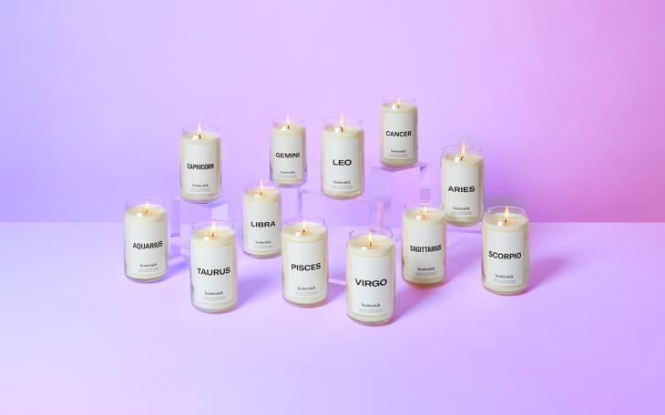 Zodiac-themed candles labeled with astrological signs on a purple gradient background.