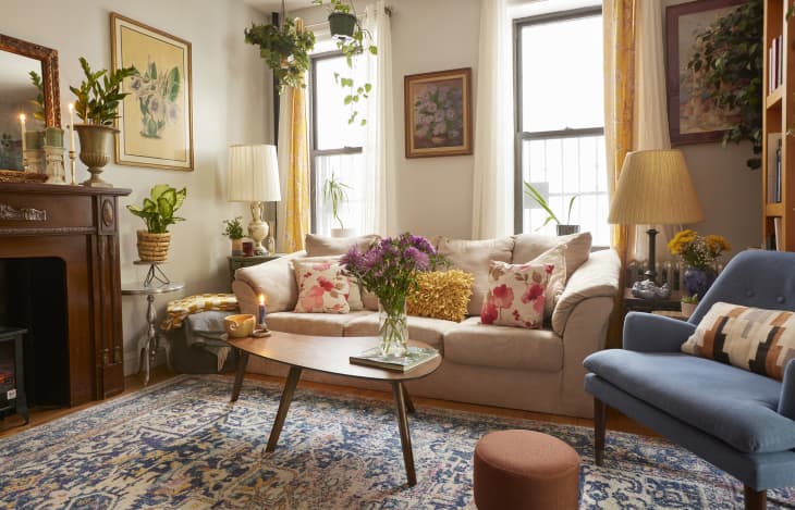 Cozy living room in plant filled Brooklyn apartment.