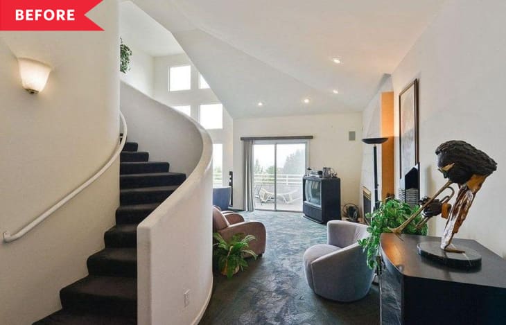 Before: carpeted living room with curved staircase