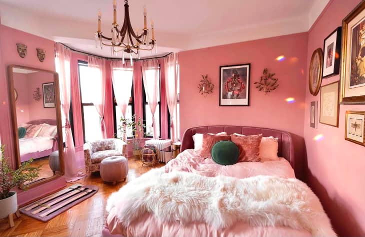 Pink painted bedroom.