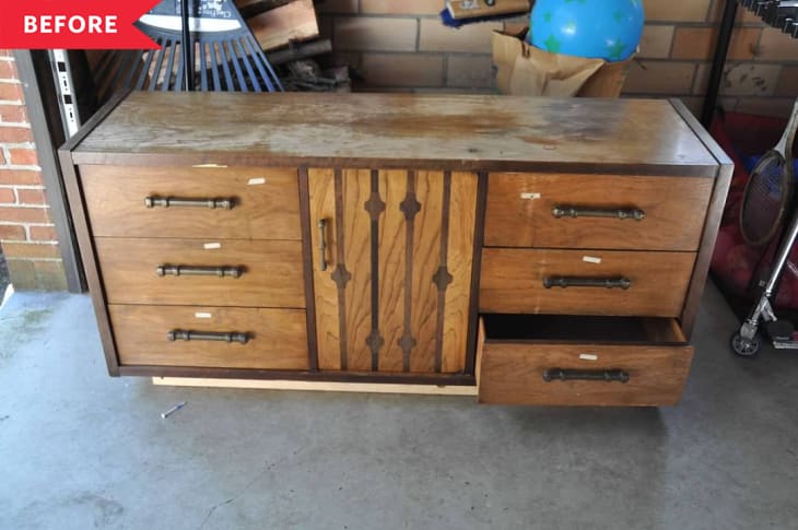 Before: Damaged wood dresser with six drawers and a center cabinet door