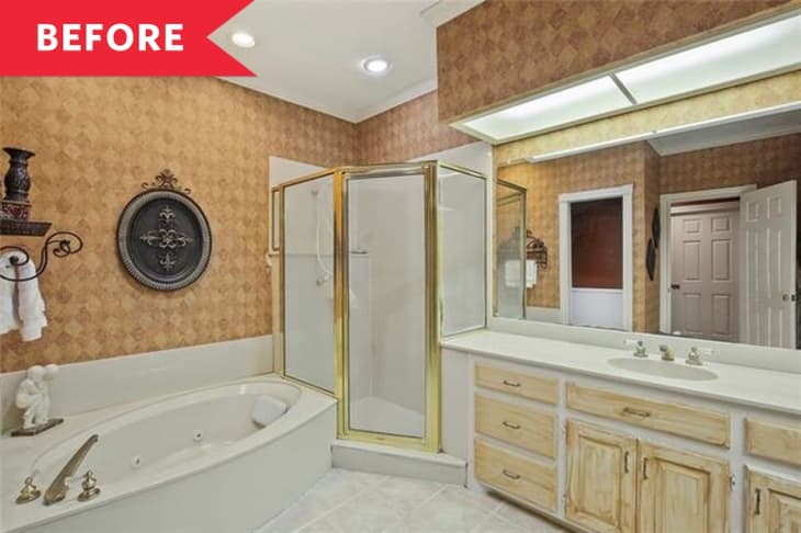 Bathroom with corner shower, large mirror, jacuzzi tub, and wooden cabinets.