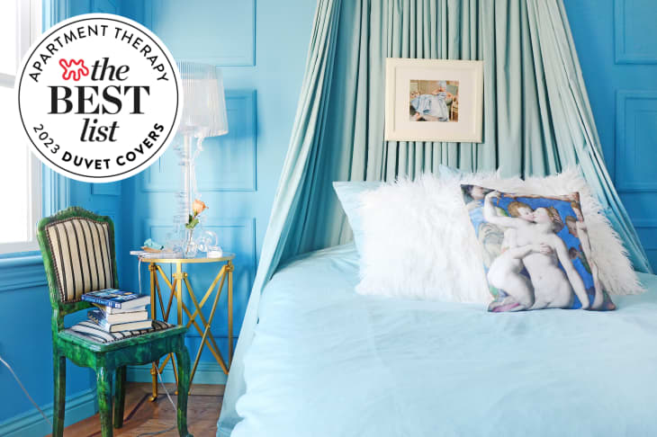 Photo of blue bedroom with bed with blue duvet. Seal in upper left corner reads "Apartment Therapy The Best List: 2023 Duvet Covers"