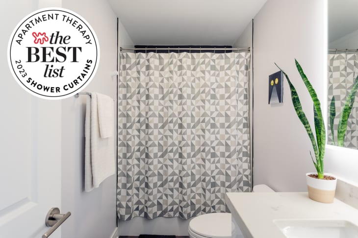 Bathroom with gray and white patterned shower curtain. Seal in upper left corner reads "apartment therapy the best list, 2023 shower curtains"