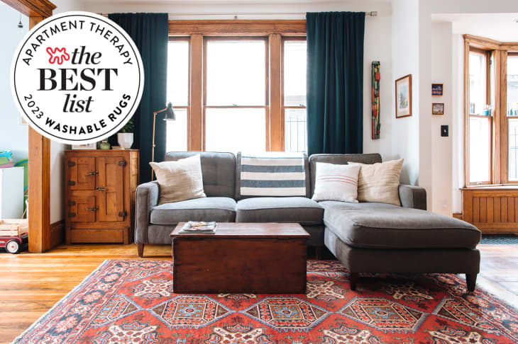 Image of living room with gray sofa, patterned rug. Seal in upper left reads "Apartment Therapy the Best List 2023 Washable Rugs"