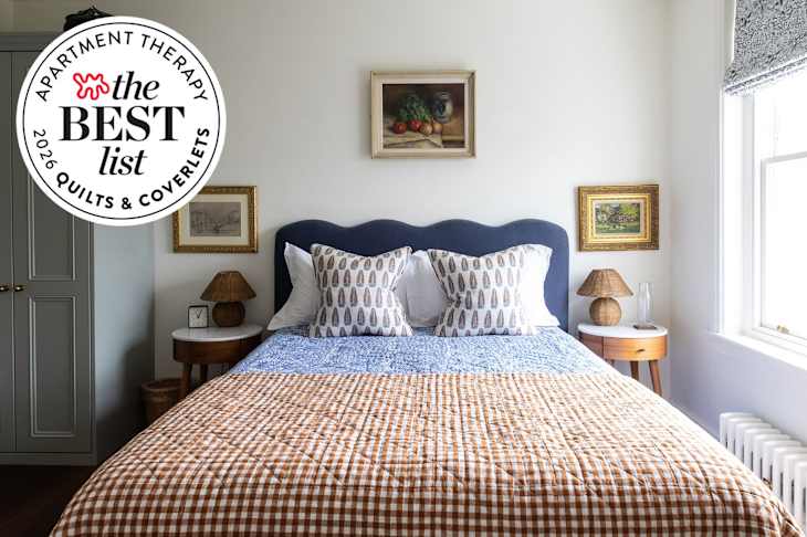 Bed with layered coverlet and quilt with best list seal in upper left
