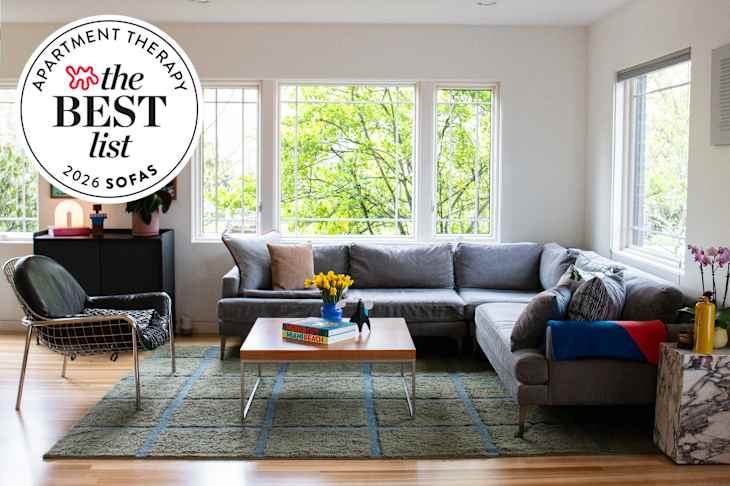 Living room with gray sectional sofa with best list seal in upper left