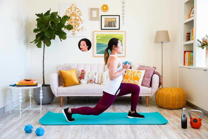 Woman in Beige Activewear Sitting on Yoga Mat · Free Stock Photo