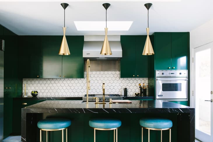 Black and White Cabinet Kitchen with Gold Accents and Waterfall