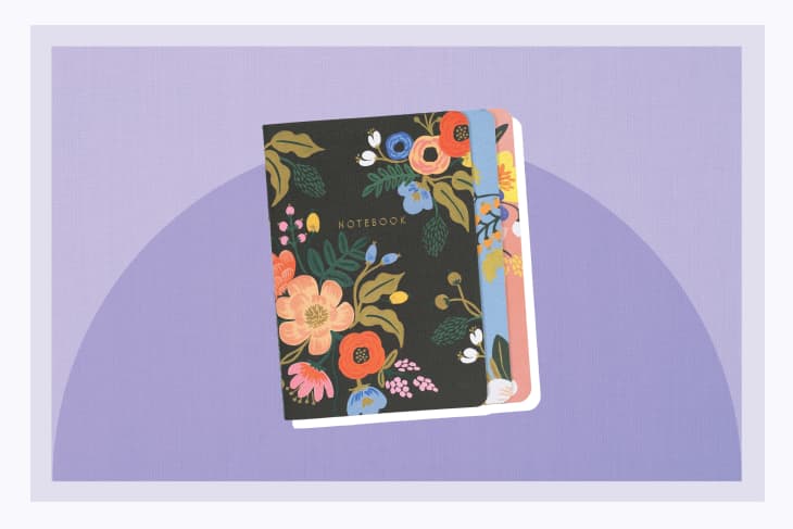 Rifle Paper Co. flower notebooks on a purple background