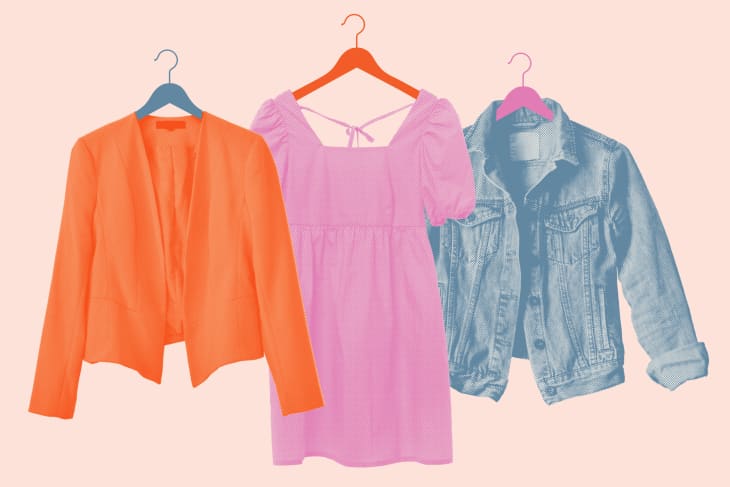 Orange blazer, pink dress, and denim jacket on hangers against a light background.