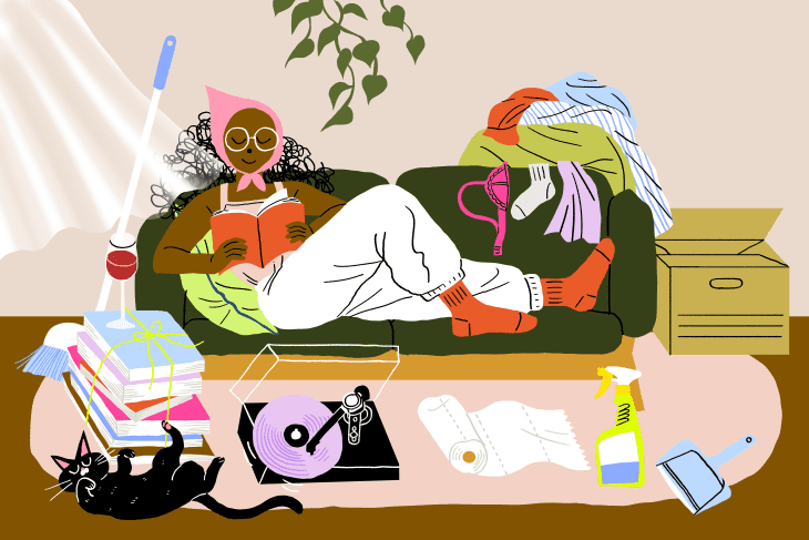 Illustration of a woman on her couch reading and relaxing surrounded by a pile of laundry, a broom, and some cleaning products