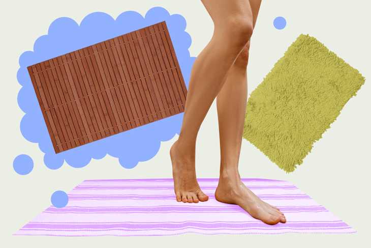 A person standing on a striped purple and white bath mat, with a wooden mat and a fluffy green rug in the background.