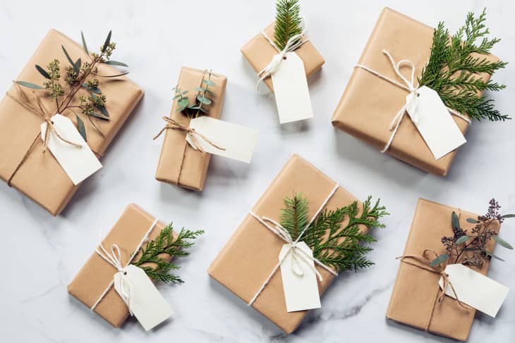 diy gift wrapped presents in brown paper, yarn, and plants
