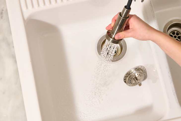 overhead shot of someone cleaning a kitchen sink