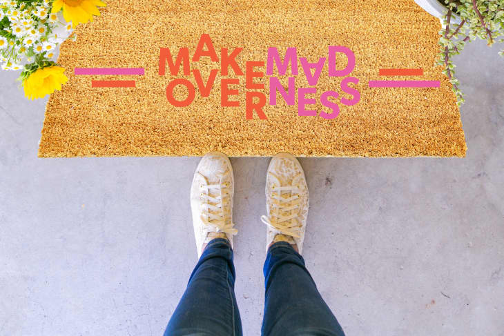 Brown doormat with "Makeover Madness" logo