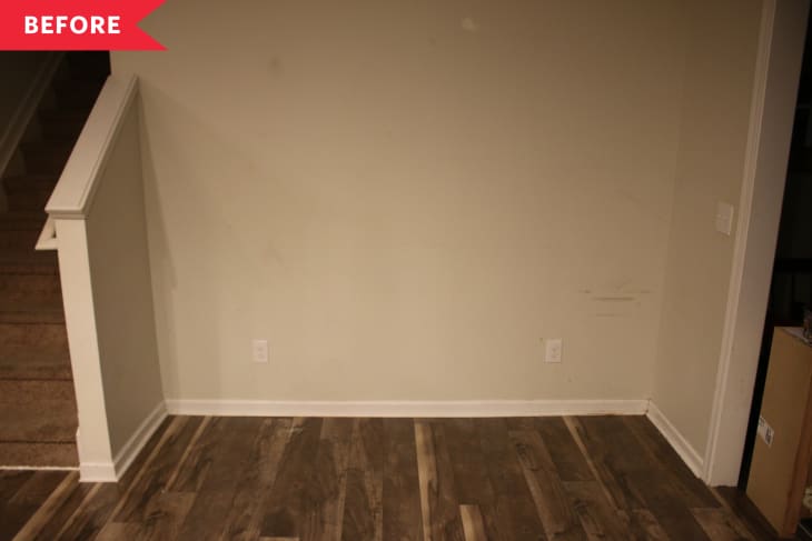 Before: Awkward empty nook with wood floors and blank wall