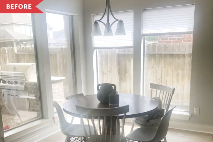 Before: bare breakfast nook with tall windows and a too-small light fixture