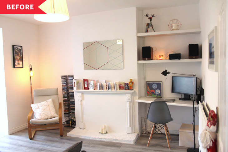 Before: living room with all white walls and shelves