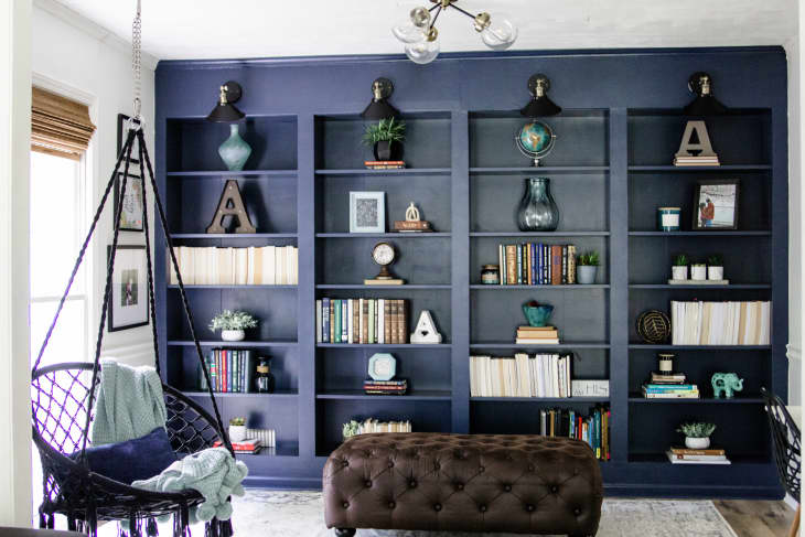 living room with blue built-in bookcases