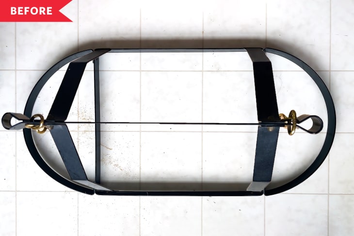 Before: empty black pot rack on a white tile floor