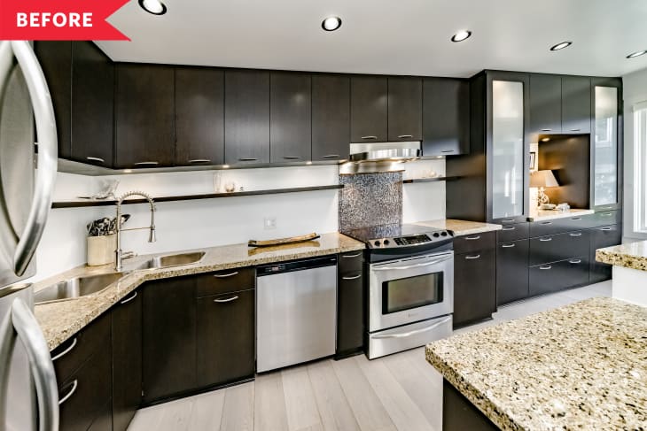 Before: Kitchen with dark cabinets and island