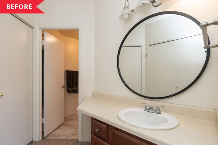 bathroom before renovation black mirror white walls