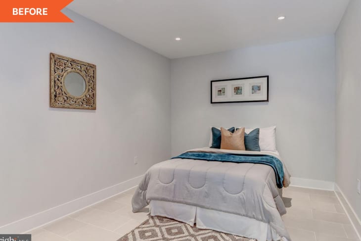 Small bedroom with a single bed, teal and beige pillows, ornate mirror, and framed artwork on a light gray wall.