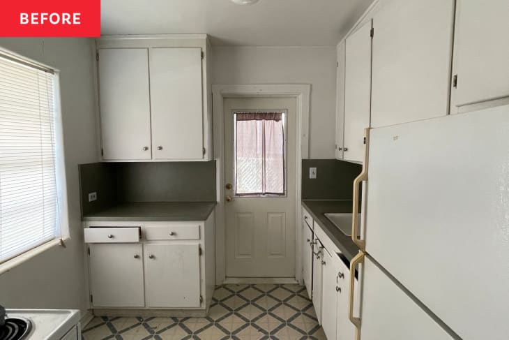 Small kitchen with white cabinets, gray countertops, and a patterned floor, featuring a door with a window.