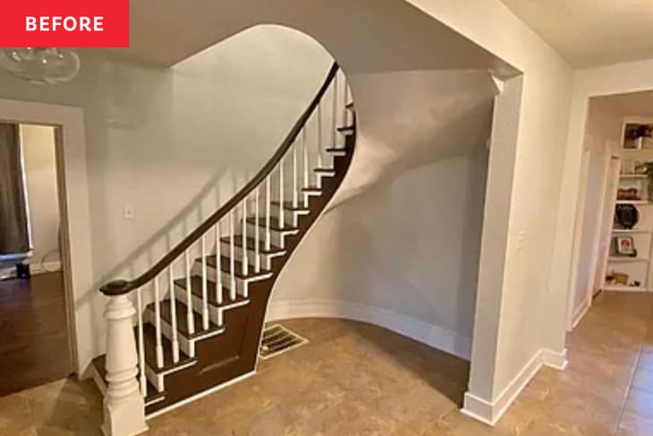 Before: a white entryway white an empty space below the stairs