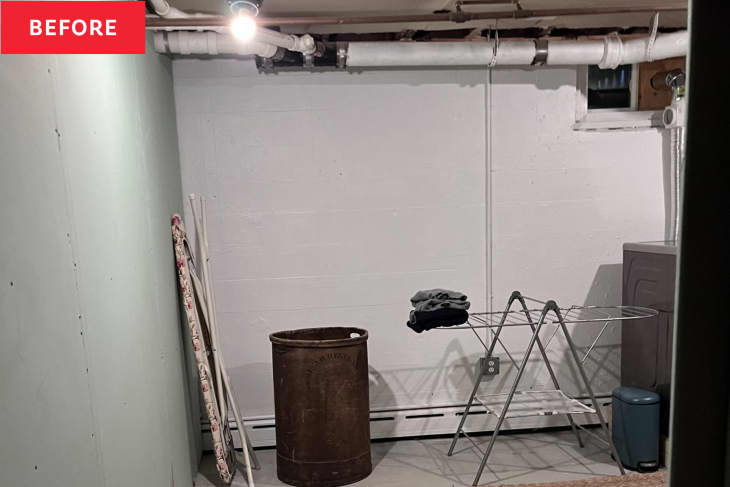 Donna Malenchini's laundry room before renovations with laundry drying rack and metal bin in corner.